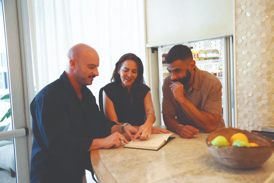 Powers team working together around a table